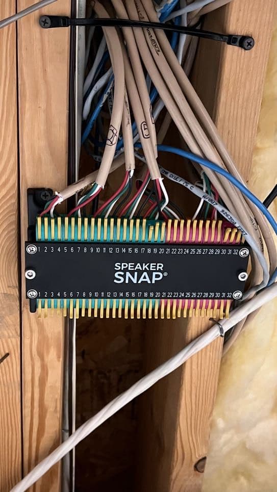 Color-coded speaker wiring landed cleanly on a labeled SpeakerSnap distribution panel